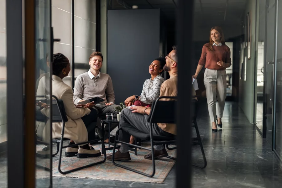 Workers in workplace having a conversation